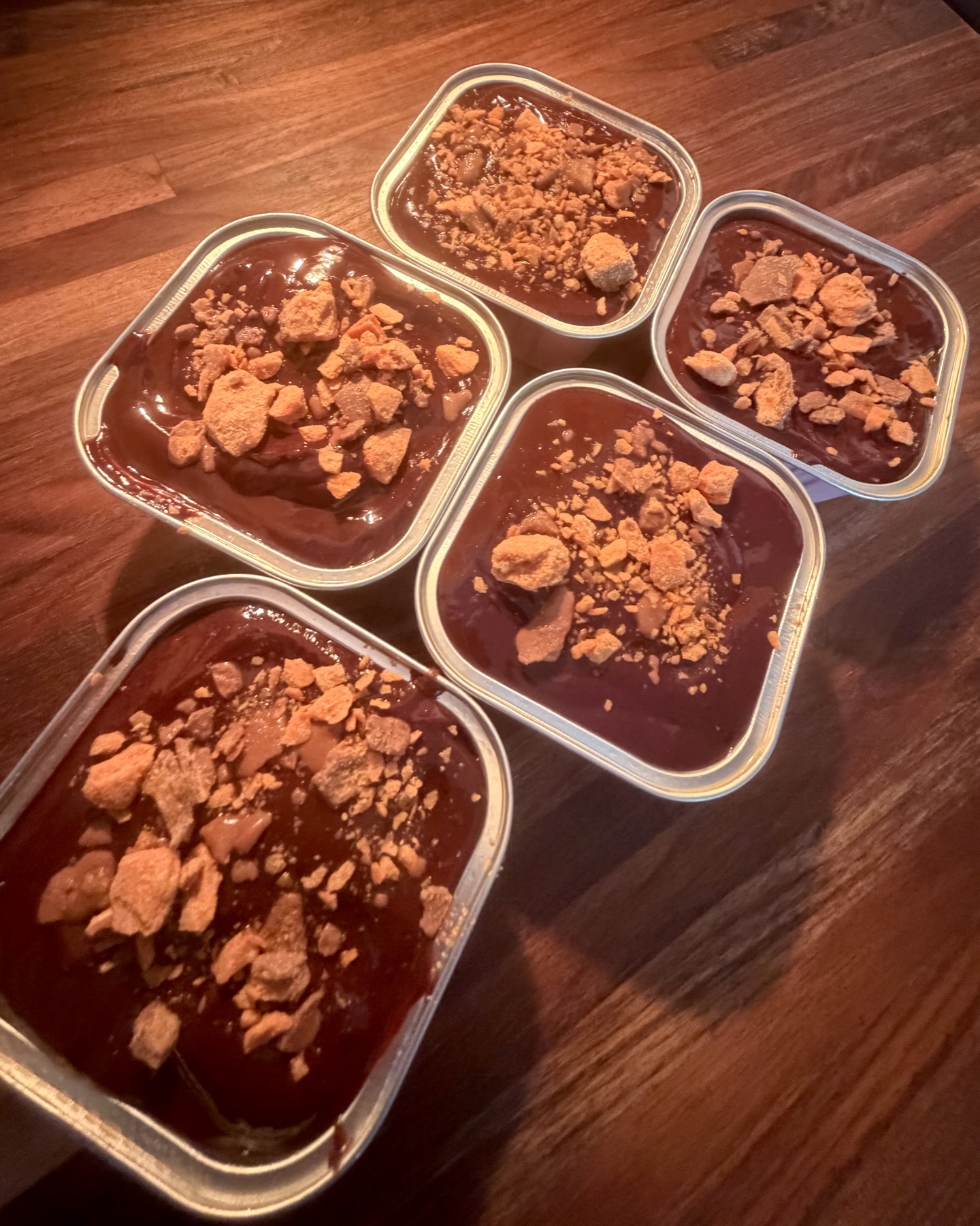 Heather's chocolate-topped dessert tins finished with golden Butterfinger pieces